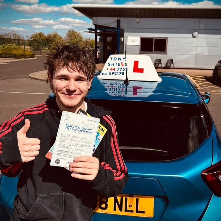 Learner celebrating passing their driving test