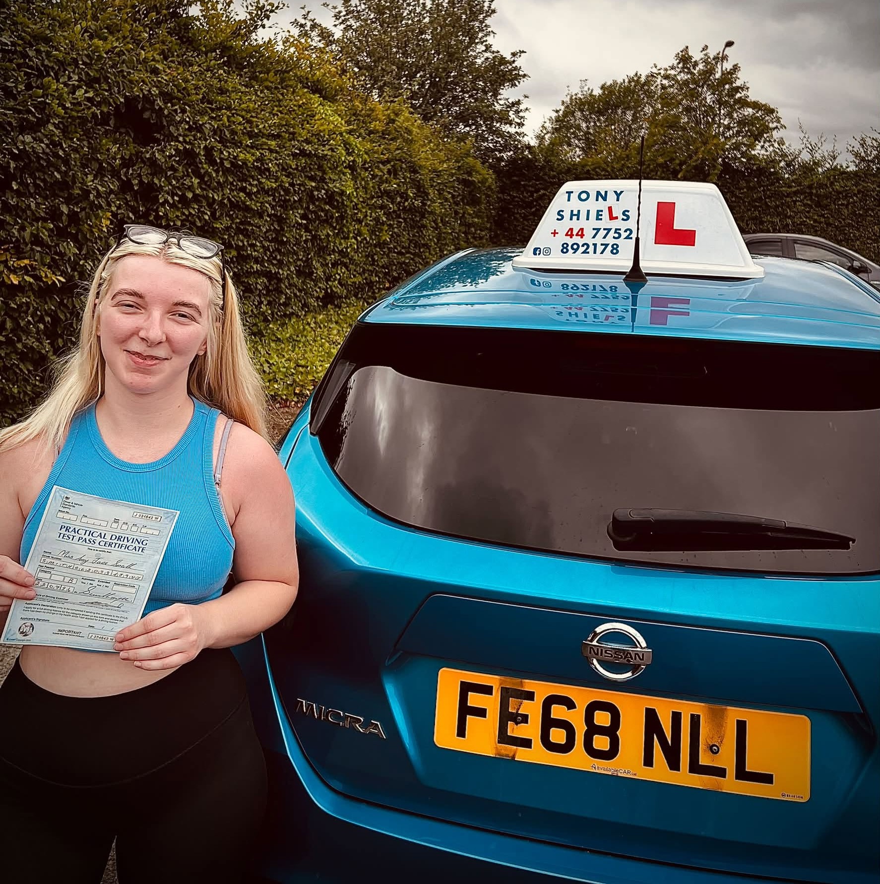 Learner celebrating passing their driving test