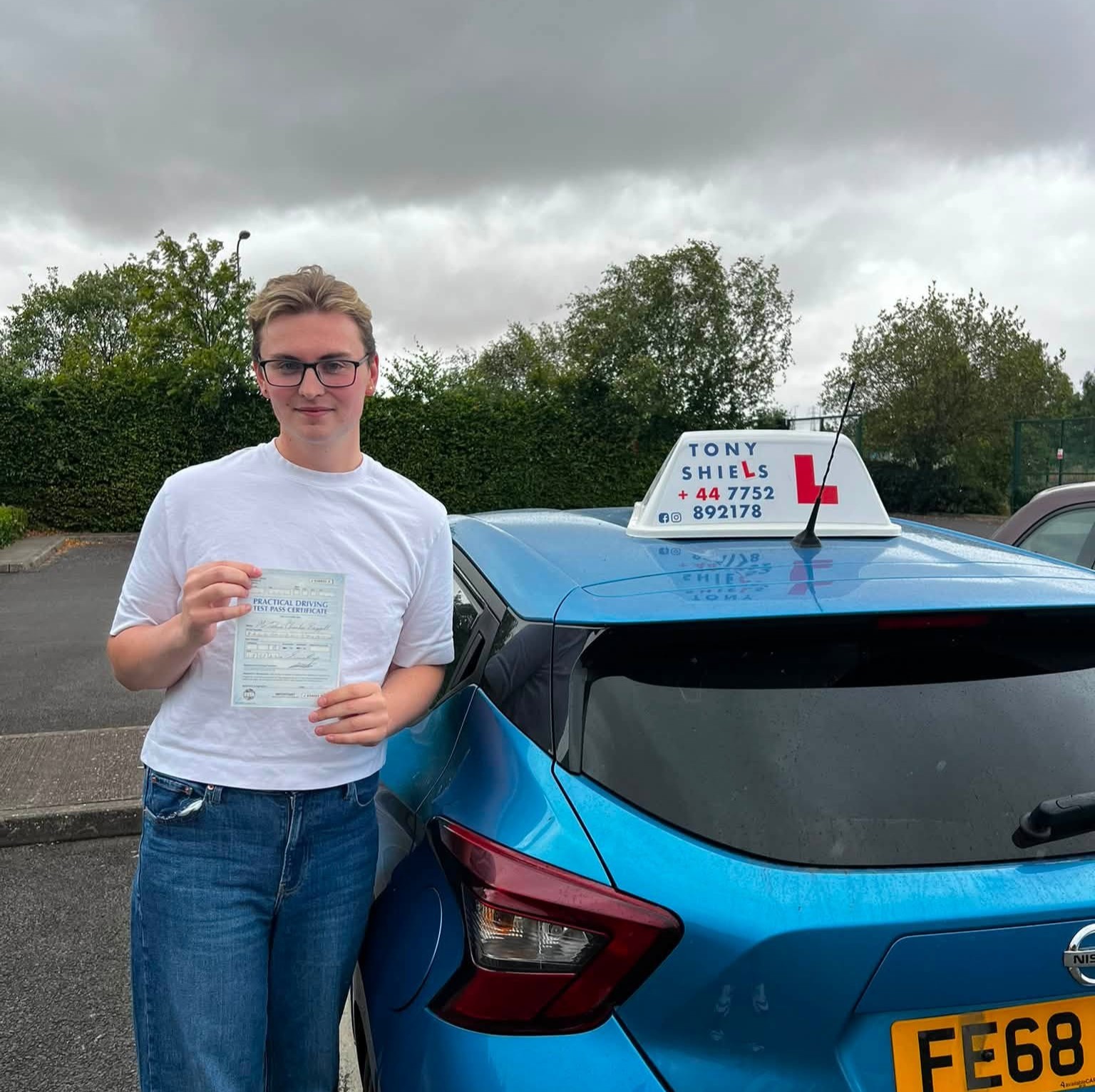 Learner celebrating passing their driving test
