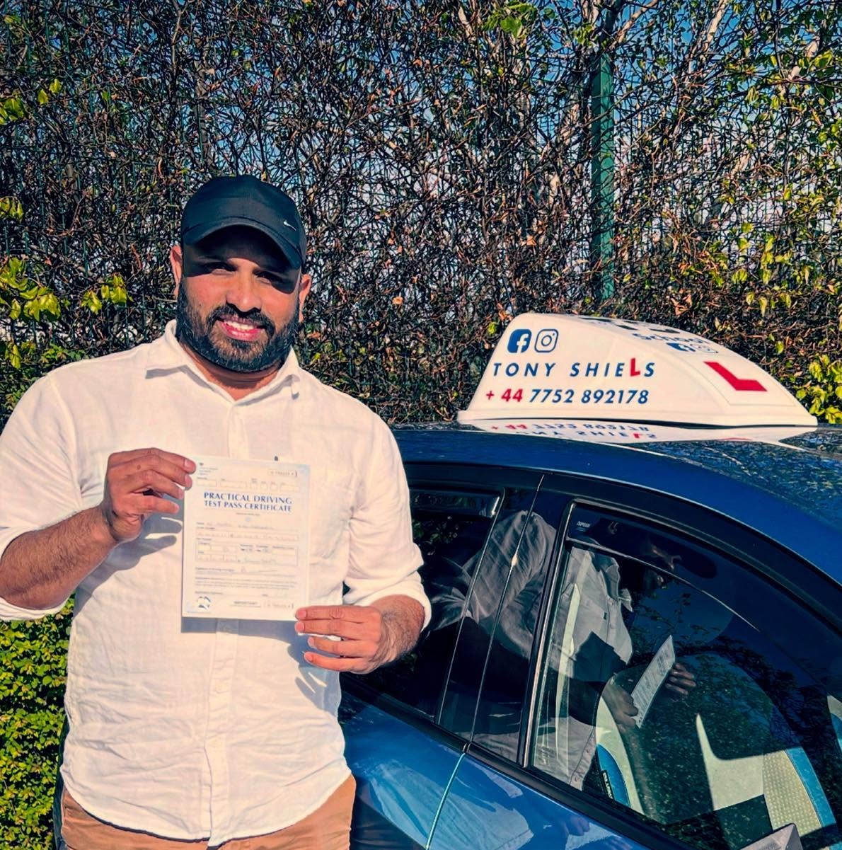 Learner celebrating passing their driving test