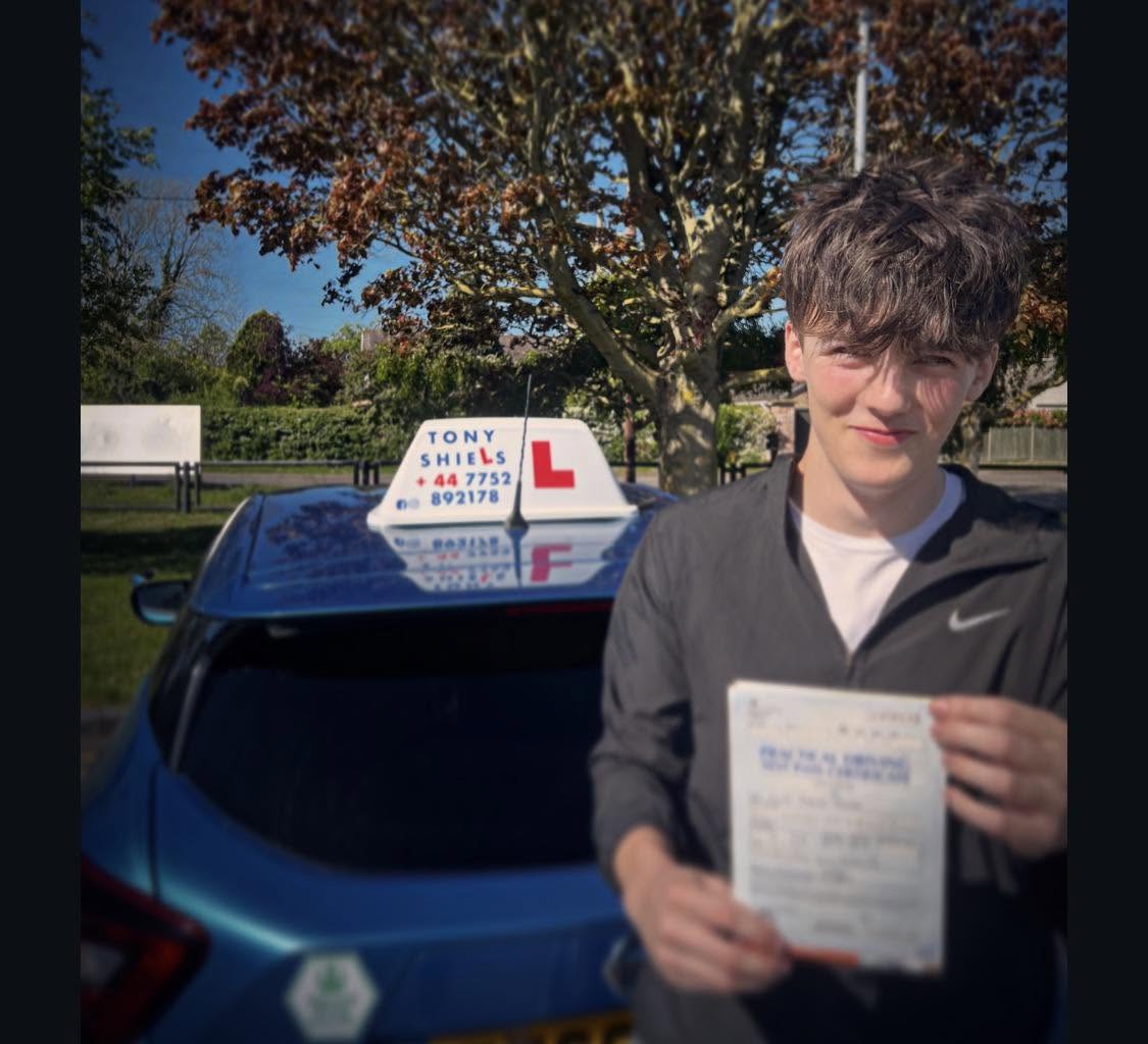 Learner celebrating passing their driving test
