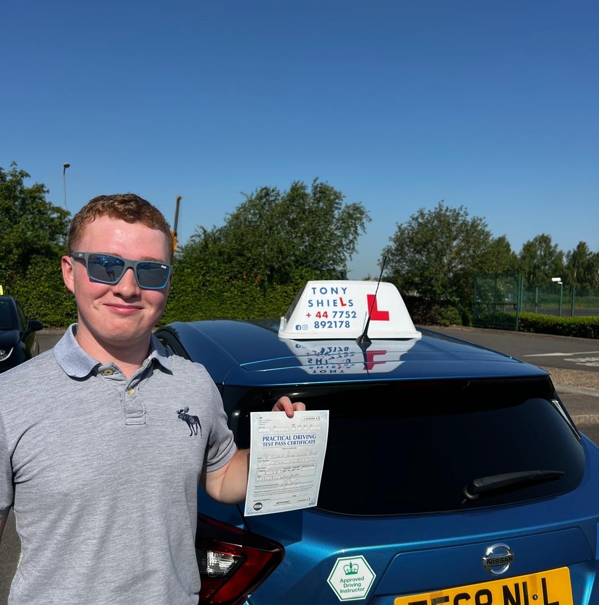 Learner celebrating passing their driving test